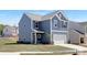 Beautiful new construction home with blue siding, white trim, and a two-car garage, located in a Gathering-friendly community at 265 Red Fox Ln # 1P, China Grove, NC 28023