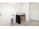 Functional laundry room with a countertop and storage for convenience at 265 Red Fox Ln # 1P, China Grove, NC 28023