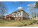 Spacious backyard featuring a wooden deck and brick foundation at 304 Keller St, China Grove, NC 28023