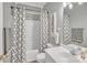 Clean bathroom featuring a shower-tub combo and single sink at 304 Keller St, China Grove, NC 28023