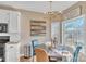 Breakfast nook offers bright natural light, views to the backyard, and tile backsplash at 304 Keller St, China Grove, NC 28023