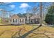 Charming two-story home with a brick and vinyl exterior, lush lawn, and an inviting entrance at 304 Keller St, China Grove, NC 28023
