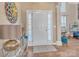 Welcoming foyer features a white front door with sidelights, a stylish rug, and gleaming hardwood floors at 304 Keller St, China Grove, NC 28023