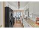 Bright eat-in kitchen features white cabinets, granite counters, and stainless steel appliances at 304 Keller St, China Grove, NC 28023