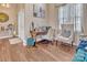 Comfortable living room with hardwood floors, bright windows, and a welcoming atmosphere at 304 Keller St, China Grove, NC 28023