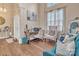 Sun-filled living room boasts vaulted ceilings, abundant natural light, and beautiful hardwood floors at 304 Keller St, China Grove, NC 28023