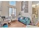 Well-lit living room with hardwood floors, large windows, and modern furnishings at 304 Keller St, China Grove, NC 28023