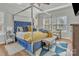 Bedroom with a canopy bed, natural light, and hardwood floors at 304 Keller St, China Grove, NC 28023