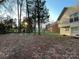 Spacious backyard featuring mature trees and a lush lawn, great for outdoor enjoyment at 312 Radio Rd, Charlotte, NC 28216