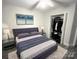 This bedroom has a serene retreat with modern decor, closet, and soft, inviting bedding at 312 Radio Rd, Charlotte, NC 28216
