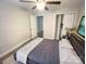 Cozy bedroom with ample natural light, plush carpeting, and a relaxing ambiance at 312 Radio Rd, Charlotte, NC 28216