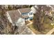 Aerial view of a two-story home with a manicured lawn, attached garage, and blue shutters at 3620 Cole Mill Rd, Charlotte, NC 28270