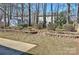 Landscaped backyard with multiple trees and a storage shed at 3620 Cole Mill Rd, Charlotte, NC 28270