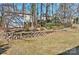 Backyard featuring tiered landscaping and a storage shed at 3620 Cole Mill Rd, Charlotte, NC 28270