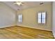 Bright bedroom with wood floors and bright windows at 3620 Cole Mill Rd, Charlotte, NC 28270