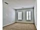 Spacious bedroom with neutral carpet and bright natural light from two large windows at 3620 Cole Mill Rd, Charlotte, NC 28270