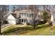 Charming two-story home with a manicured lawn and attached garage at 3620 Cole Mill Rd, Charlotte, NC 28270
