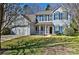 Charming two-story home featuring blue shutters, a front porch, and a well-maintained lawn on a sunny day at 3620 Cole Mill Rd, Charlotte, NC 28270