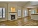 Open living space with fireplace, bright windows, and wood floors at 3620 Cole Mill Rd, Charlotte, NC 28270