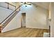 Spacious living room features high ceilings, wood floors, and staircase to second level at 3620 Cole Mill Rd, Charlotte, NC 28270