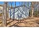 Well-maintained storage shed in a lush backyard setting at 3620 Cole Mill Rd, Charlotte, NC 28270