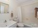 Clean bathroom featuring a shower-tub combo, a toilet, and a sink with towels at 405 Northwest Dr, Davidson, NC 28036
