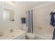 Neat bathroom includes a vanity, toilet and shower with blue striped curtain at 405 Northwest Dr, Davidson, NC 28036
