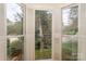 Inviting bay window offers verdant views of the professionally landscaped yard at 405 Northwest Dr, Davidson, NC 28036