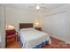 Cozy bedroom includes hardwood floors, ample closet space, and a ceiling fan at 405 Northwest Dr, Davidson, NC 28036