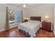 Inviting bedroom features hardwood floors, a cozy window seat, and plenty of natural light at 405 Northwest Dr, Davidson, NC 28036