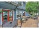 Well-furnished outdoor deck with a charming porch swing overlooking the lake at 405 Northwest Dr, Davidson, NC 28036