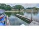 Scenic view of the private boat dock, perfect for enjoying lake access and recreational activities at 405 Northwest Dr, Davidson, NC 28036