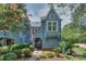 Charming home exterior with unique architecture, mature landscaping, and inviting entrance at 405 Northwest Dr, Davidson, NC 28036