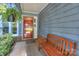 Inviting front porch with a bench, potted plants, and a charming entrance at 405 Northwest Dr, Davidson, NC 28036
