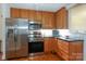 Modern kitchen featuring stainless steel appliances and wooden cabinetry at 405 Northwest Dr, Davidson, NC 28036
