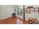 Office space features wood floors and bright light from window with shelves and storage at 405 Northwest Dr, Davidson, NC 28036