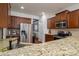 Modern kitchen features granite countertops, stainless steel appliances, and wood cabinets at 4903 El Molino Dr, Charlotte, NC 28214