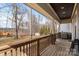 Charming back porch with wood flooring and views of the wooded back yard at 4915 Ardenwoods Dr, Charlotte, NC 28215