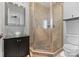 Bathroom featuring a corner walk-in shower, vessel sink vanity, and tile floor at 4915 Ardenwoods Dr, Charlotte, NC 28215