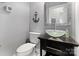 Sleek bathroom featuring a vessel sink, modern fixtures, and stylish decor at 4915 Ardenwoods Dr, Charlotte, NC 28215