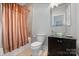 Bathroom with modern glass vessel sink, shower and tub combination at 4915 Ardenwoods Dr, Charlotte, NC 28215