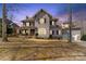 Charming two-story home showcasing beautiful architectural details and a welcoming front yard at 4915 Ardenwoods Dr, Charlotte, NC 28215