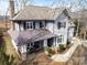 Beautiful two-story home with covered porch, brick chimney, and landscaped front yard at 4915 Ardenwoods Dr, Charlotte, NC 28215
