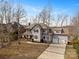 Beautiful two-story home with a well-maintained lawn, mature trees, and a two-car garage at 4915 Ardenwoods Dr, Charlotte, NC 28215