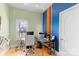 Contemporary home office space with neutral tones, modern desk, and ample natural light at 4915 Ardenwoods Dr, Charlotte, NC 28215