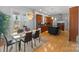 Open-concept kitchen and dining area featuring modern appliances and a kitchen island at 4915 Ardenwoods Dr, Charlotte, NC 28215