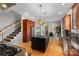 Open-concept kitchen with modern stainless steel appliances and central island that connects to a dining and living area at 4915 Ardenwoods Dr, Charlotte, NC 28215