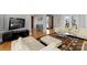 Open-concept living room with hardwood floors and modern decor, perfect for entertaining at 4915 Ardenwoods Dr, Charlotte, NC 28215