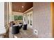 Cozy covered porch with comfortable seating, perfect for relaxation and enjoying the outdoors at 4915 Ardenwoods Dr, Charlotte, NC 28215