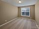 Comfortable bedroom featuring neutral carpet, a window for natural light, and ample space at 509 Riviera Pl, Rock Hill, SC 29730